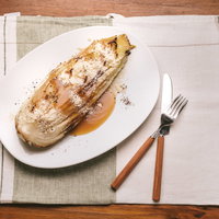 秋の深い森を流れる渓流と紅葉の写真