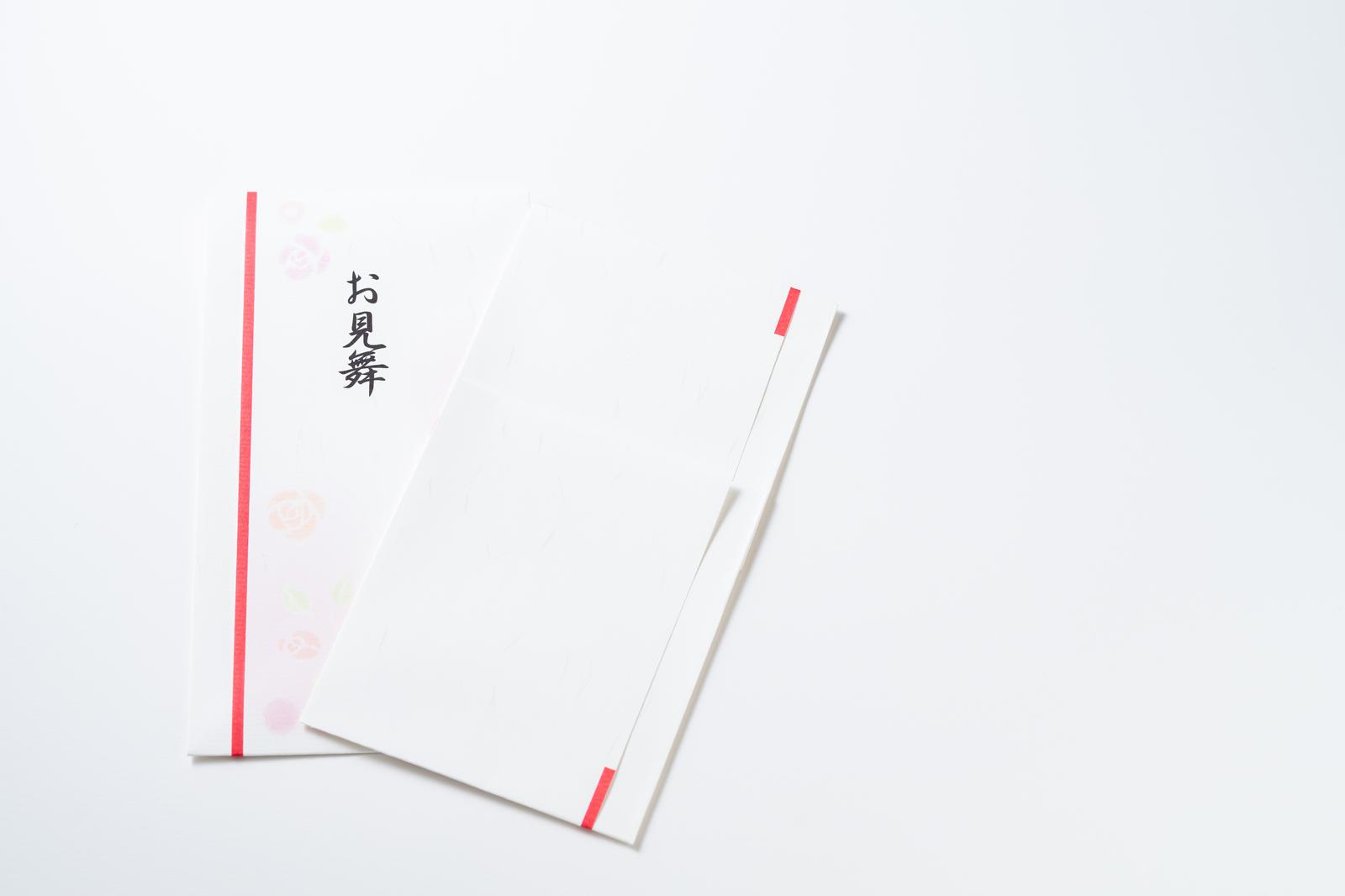 Two get-well greeting cards with red mizuhiki cords on a white background