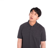 やる気が起きない男性の無気力で疲れた無表情の写真