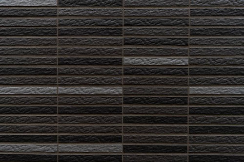 黒とグレーの濃淡があるレンガ調外壁
