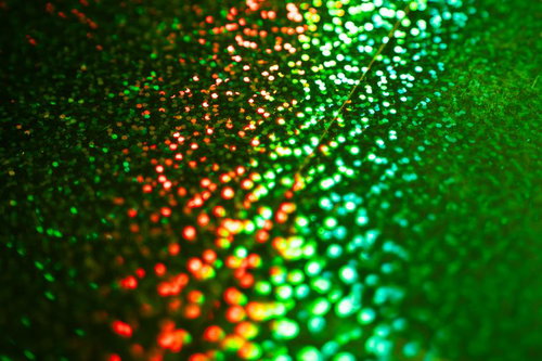 緑の光る粒子のボケ