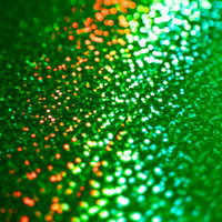 緑色のキラキラ光る粒子の写真