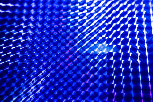 青いホログラフィック光の波紋パターン
