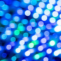 光る円形ボケが輝くホロカード風デジタル背景の写真