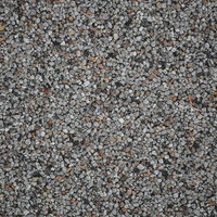 灰色や茶色の小さな石が集まった小石のテクスチャーの写真