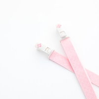 ピンクの着物用帯締めに付いたコーリンベルトの写真