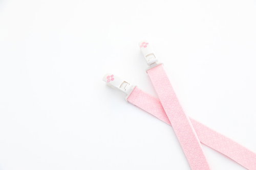 ピンクの着物用帯締めに付いたコーリンベルト