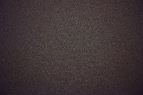 ざらついたグレーの壁面テクスチャー写真