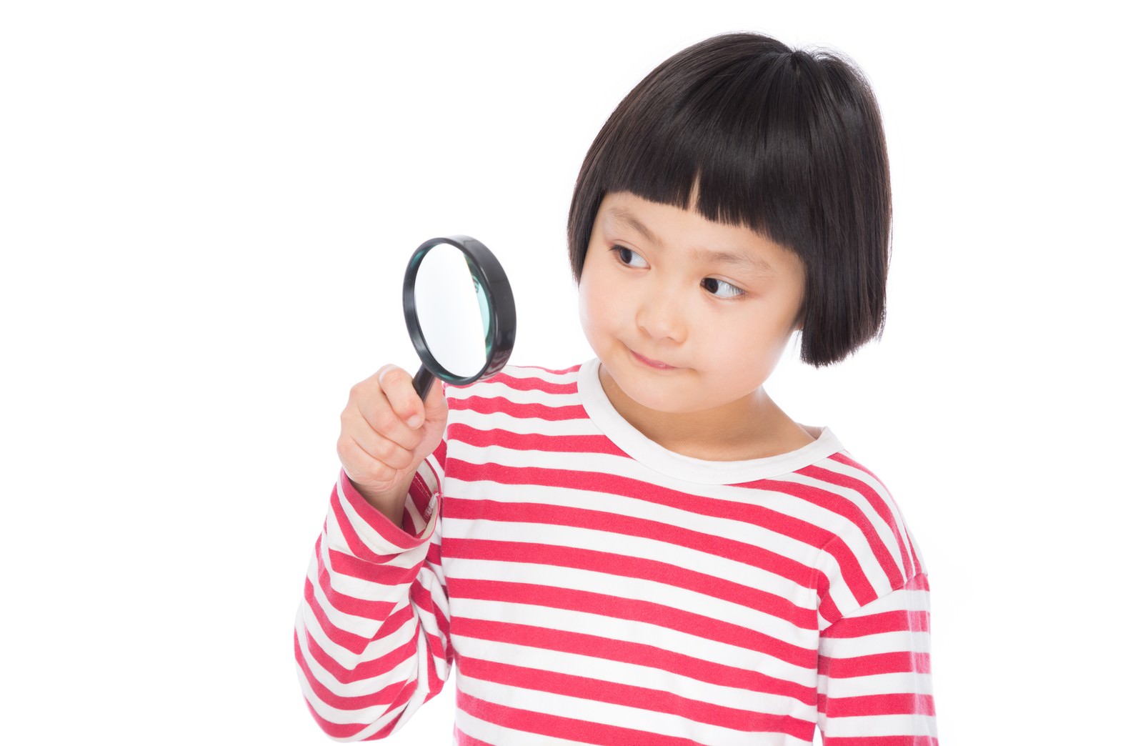 A girl in a red and white striped shirt with blunt bangs examining something with a magnifying glass