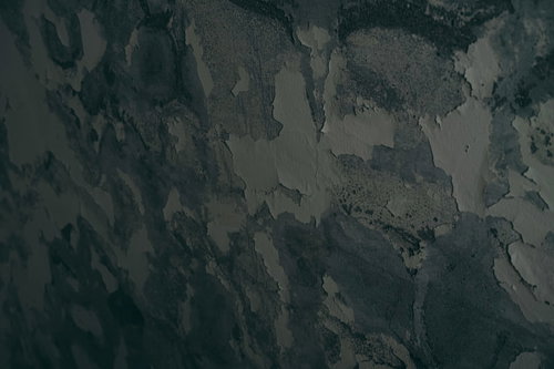 塗装が剥がれ落ちる古い壁のテクスチャー