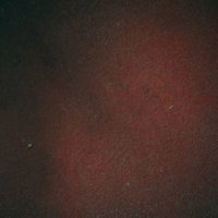 ざらざらした質感のえんじ色の壁テクスチャーの写真