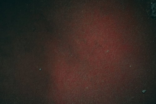 ざらざらした質感のえんじ色の壁テクスチャー