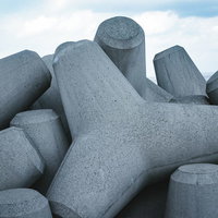 海岸の防波堤に積み上げられた消波ブロックの写真