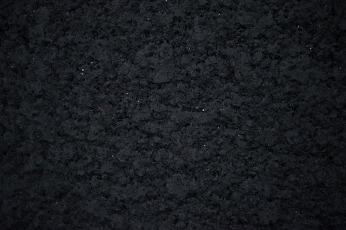 白い細かい粒とアスファルトのテクスチャー