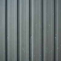 白いペンキが飛び散ったトタンのテクスチャーの写真