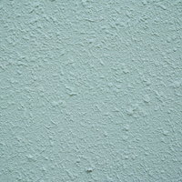 粗い塗装の外壁のテクスチャーの写真