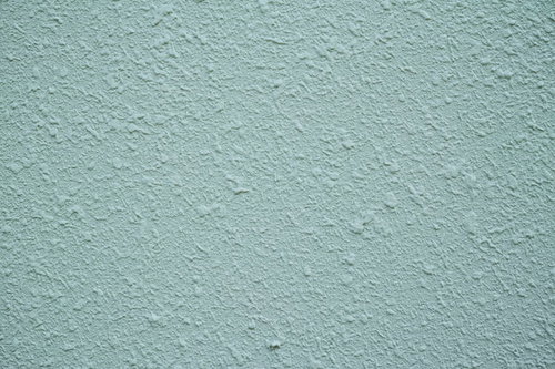 粗い塗装の外壁のテクスチャー