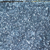 グレーの大きめな石タイル（テクスチャー）の写真