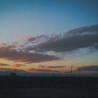 夕焼け色に染まる空のグラデーションの写真