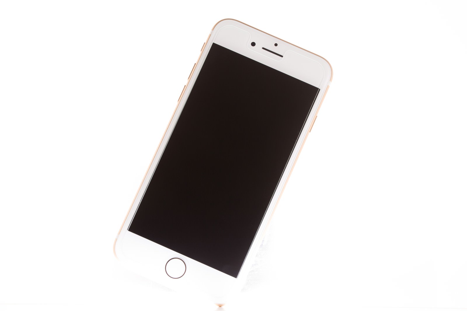 白背景に斜めに置かれたゴールドのiPhone