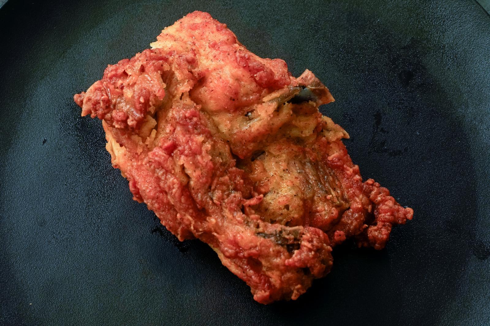 A plate of glistening bone-in fried chicken