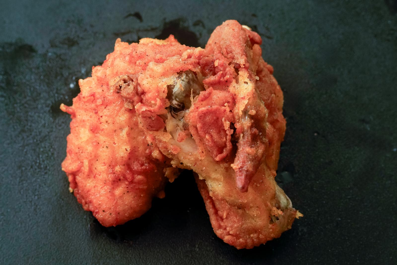 Bone-in fried chicken wings with a visible cross-section