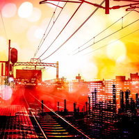 都会をつなぐ線路と夜景のフォトモンタージュの写真