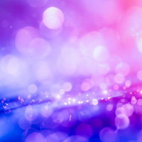 紫とピンクの光が交差する煌めきの背景テクスチャーの写真
