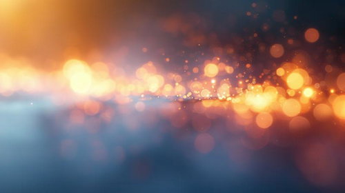 柔らかいオレンジの光が玉ボケする夜景背景