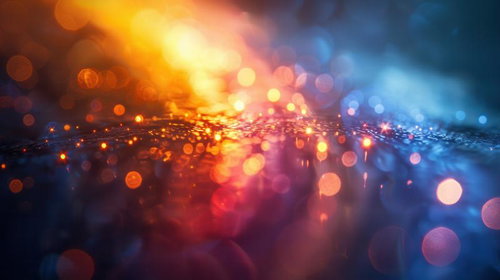 無数の光粒が広がるオレンジと青の煌めく空間