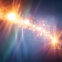 光速の軌跡が走る輝き、黒背景から放射状に広がる粒子エフェクトの写真