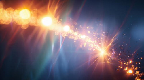 光速の軌跡が走る輝き、黒背景から放射状に広がる粒子エフェクト