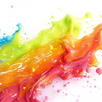 カラフルな塗料が流動する混ざり合い、波状に広がる抽象アートの写真