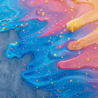 滑らかに混合する塗料とビー玉が織りなす虹色の表現の写真