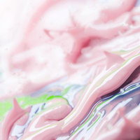 ピンクと青の塗料が流動する色彩表現の抽象アート背景の写真