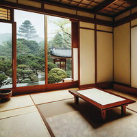 畳のある和室から眺める日本庭園の景色と縁側の風景の写真