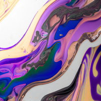 マーブル状に広がる水面のインクと絵具のテクスチャーの写真