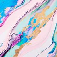 混ざりあうインクと金色の流動 ピンク青緑紫のマーブリング抽象画の写真