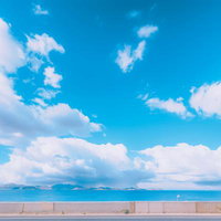 海岸沿いから眺める入道雲と大空の景観、真夏の白い雲の写真