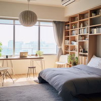 採光が豊かなインテリアで彩る寝室のベッドの写真