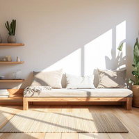 観葉植物と木製家具で揃えたシンプルなワンルームの写真