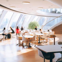 オフィスビルの高層ラウンジで進化するデスクワークの写真