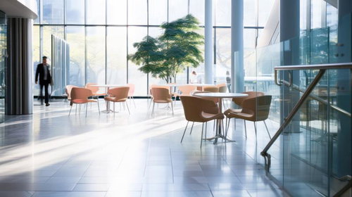 自然光が差し込む高層ビルのロビーとオフィス空間