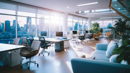 出勤前の高層階のオフィスから見える朝日と街並み