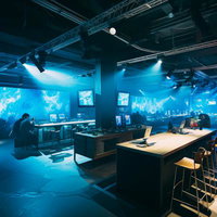巨大モニターでeスポーツの様子を眺められるイベント会場の写真