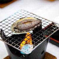 固形燃料一つくらい耐えてみせるあわびの写真