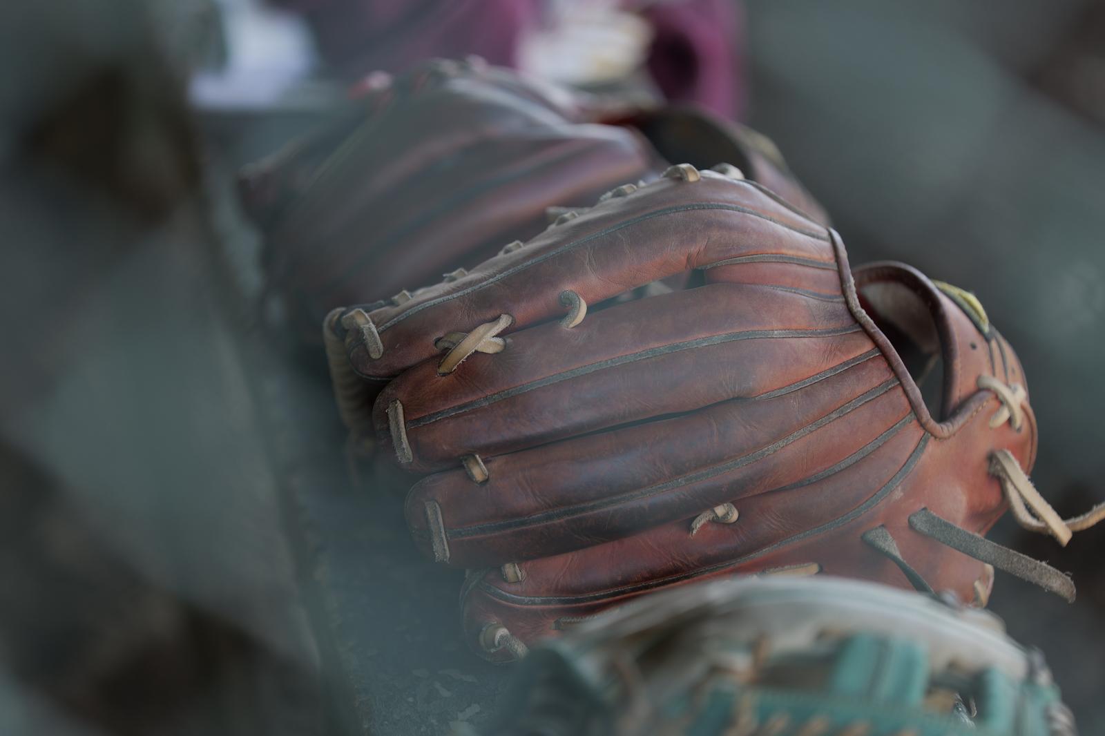 Close-up of a well-worn brown leather baseball glove