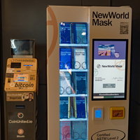 bitcoinATMに並ぶオレンジ色のマスク自動販売機の写真