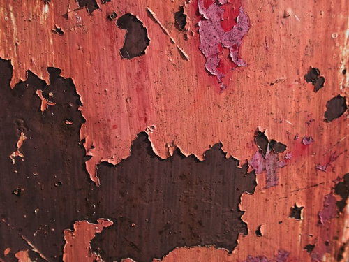 錆付いてペンキが剥げた古い鉄壁のテクスチャー