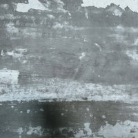 廃病院の塗装が剥がれたボロボロの壁のコンクリートの写真